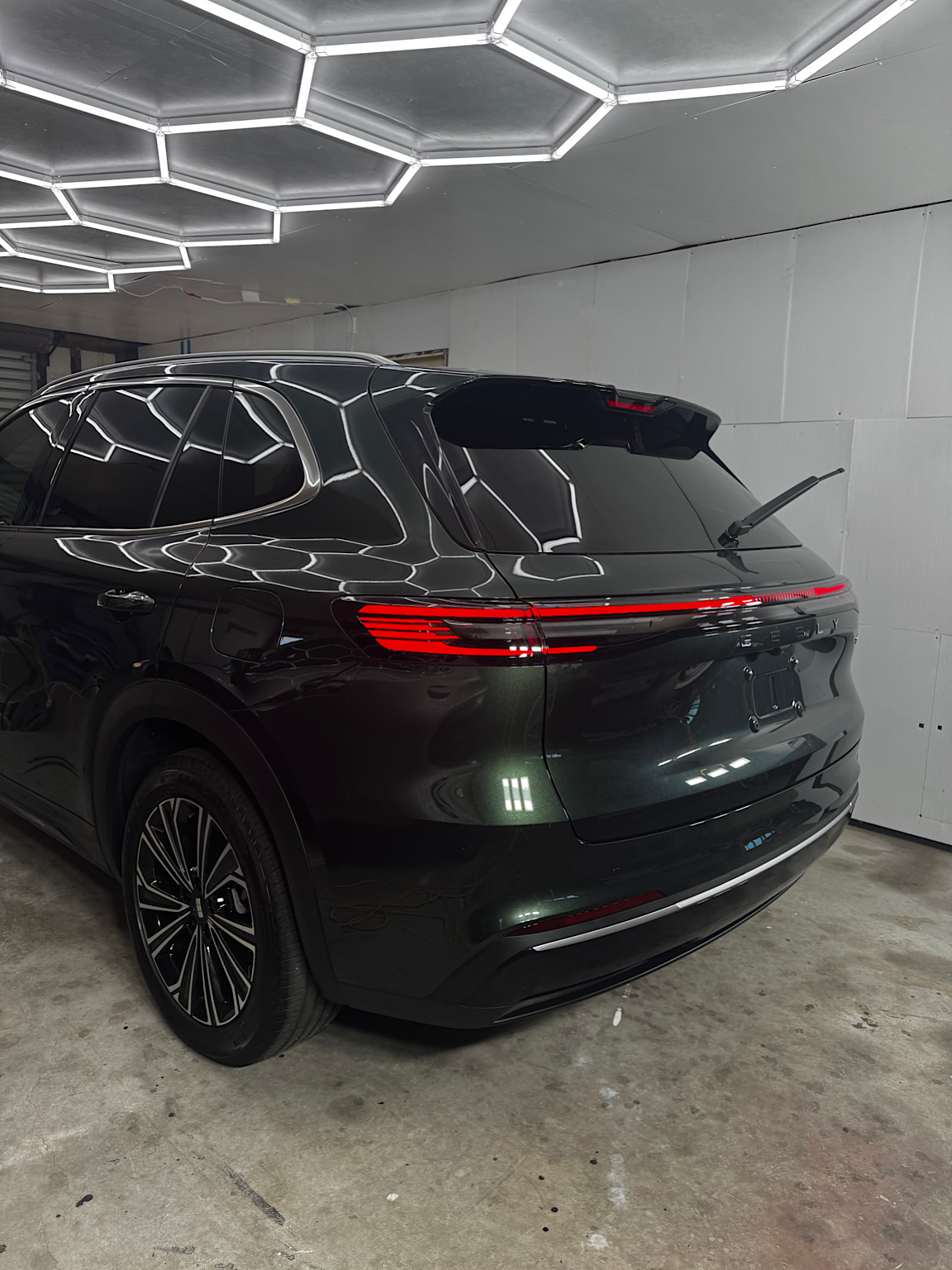 Rear three-quarter view of the finished green Geely Starray EM-i after ceramic coating and exterior protection