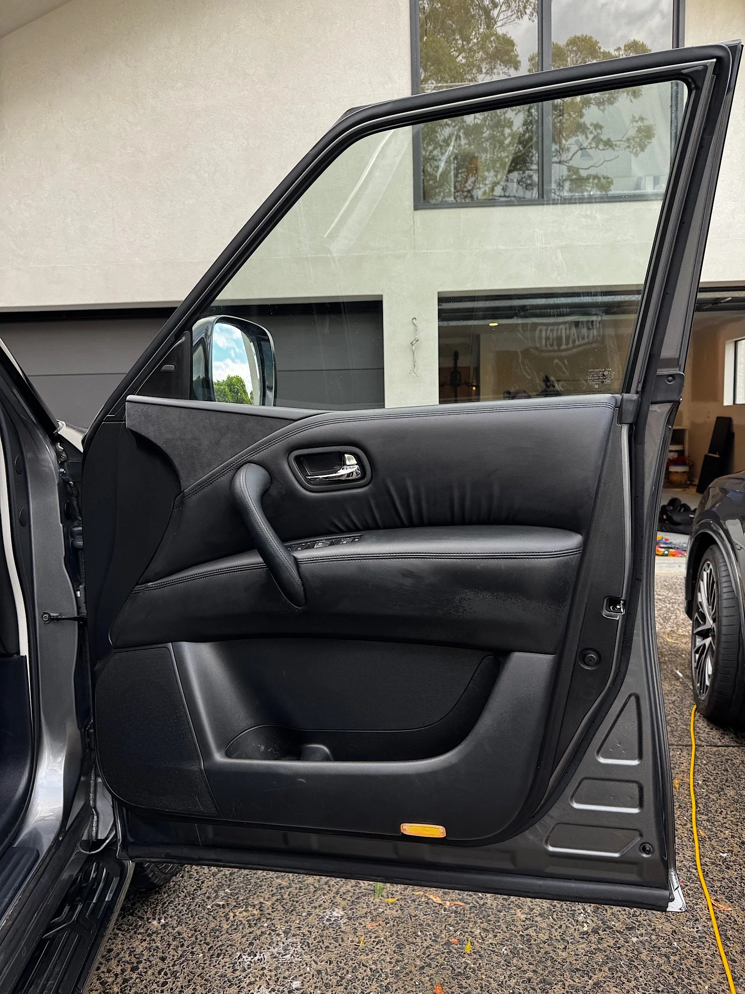 Clean Nissan Patrol Warrior door panel after interior detailing with restored finish