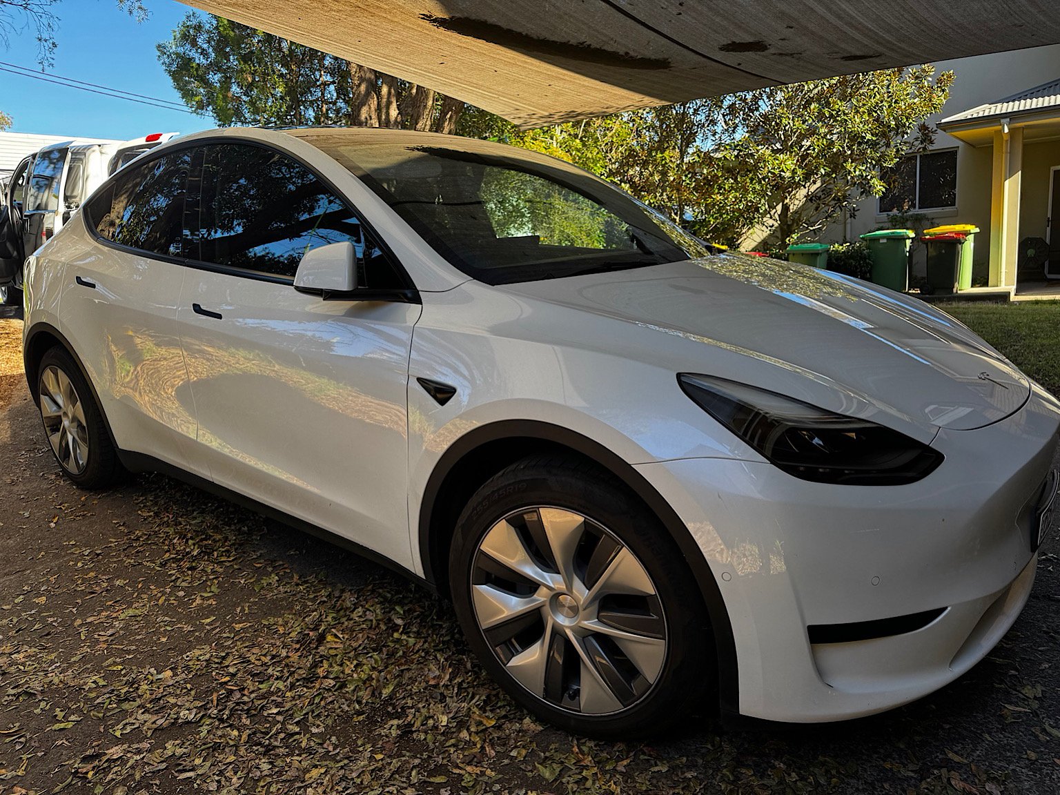 White Tesla Model Y after 3M Ceramic IR 35% front window tinting in Green Point NSW