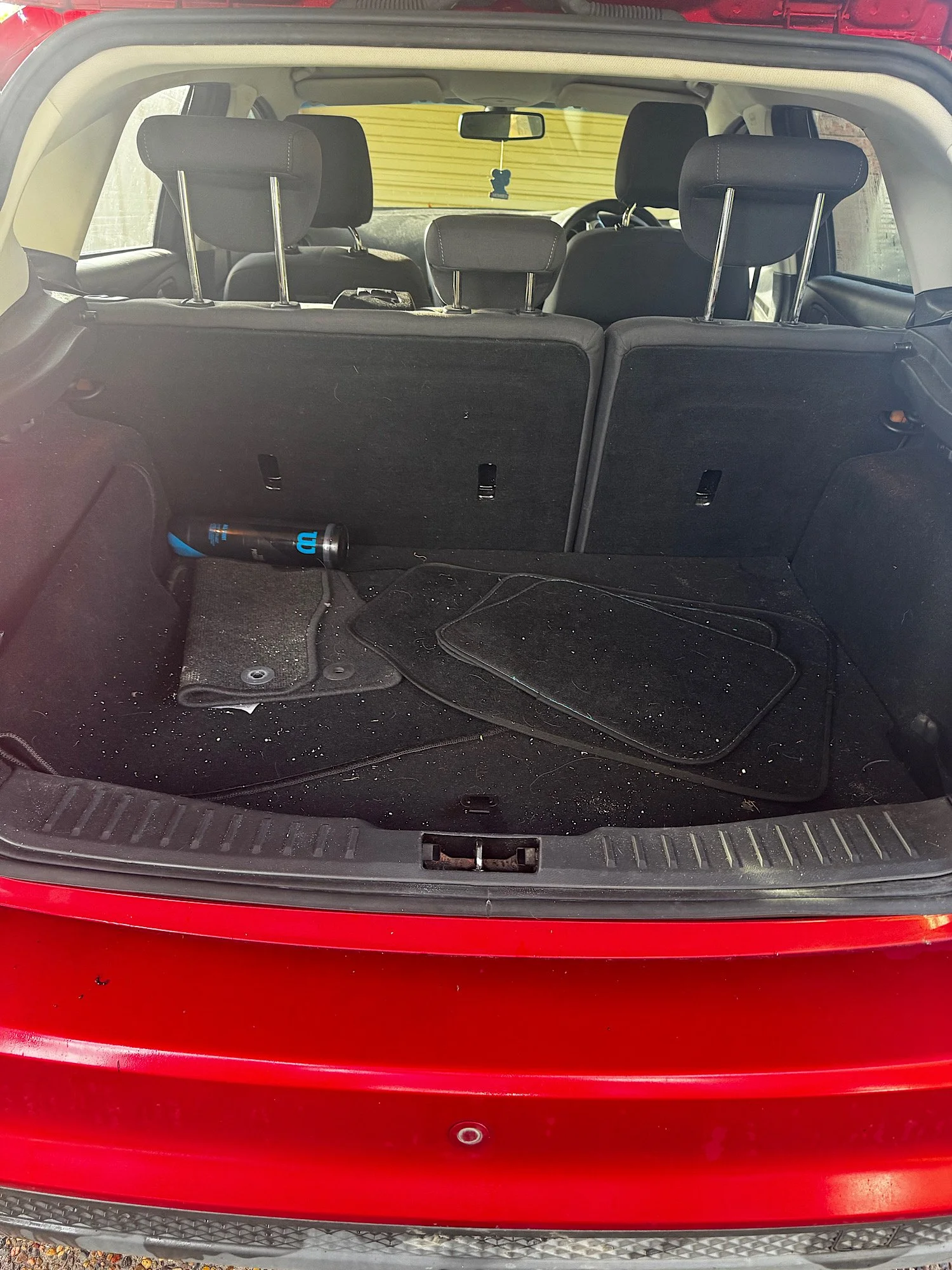 Ford Focus boot area before detailing with pet hair dirt and debris buildup