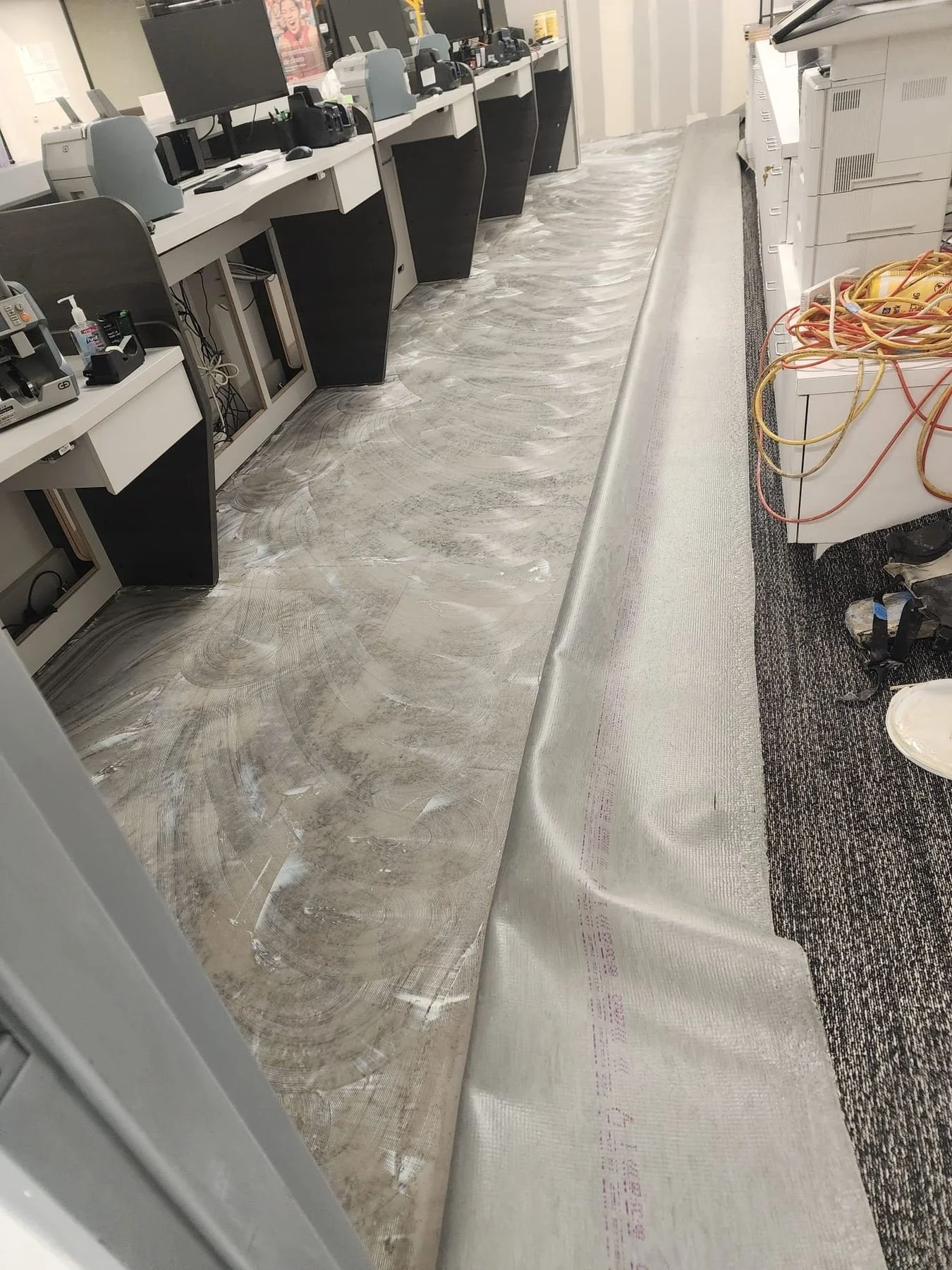 Rohnert Park bank renovation: flooring installation and seam preparation phase.