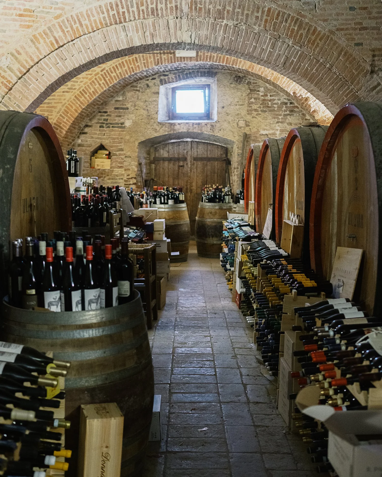 A stone-arched wine cellar in Umbria