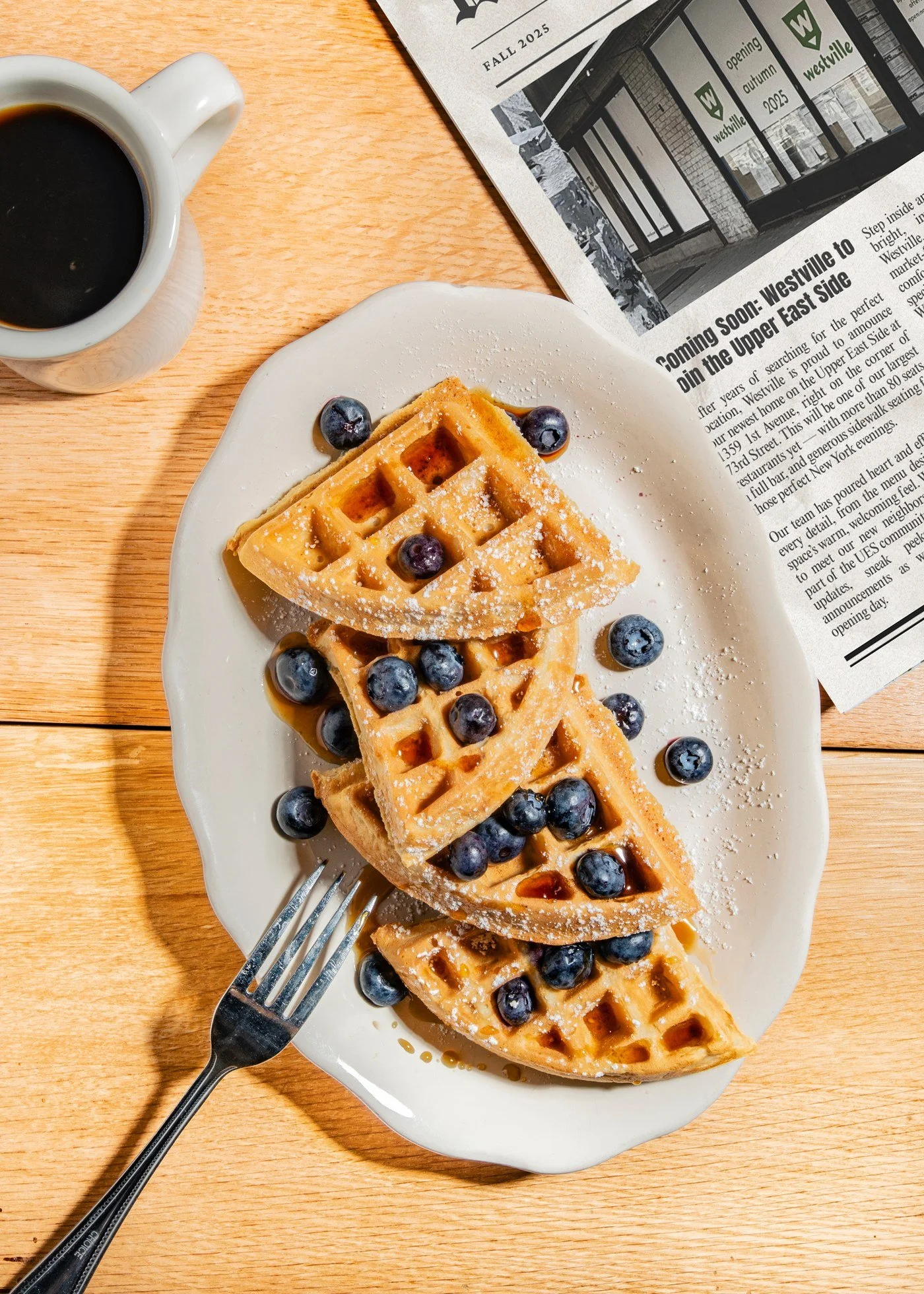Blueberry waffles and newspaper