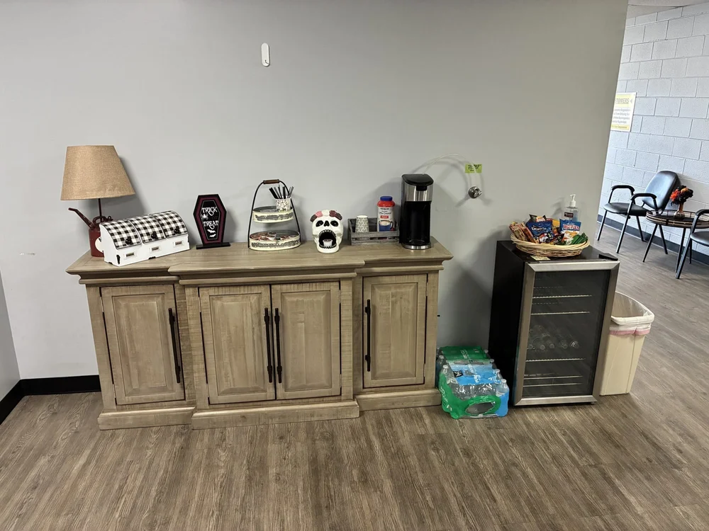 Coffee station with a coffee maker and snacks