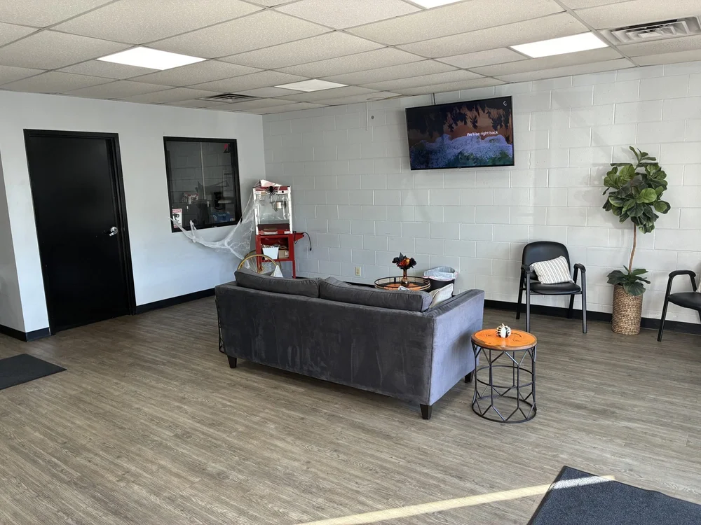 Popcorn machine and wall-mounted TV in the waiting area