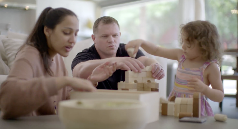 Robert building blocks at the table with his daughter
