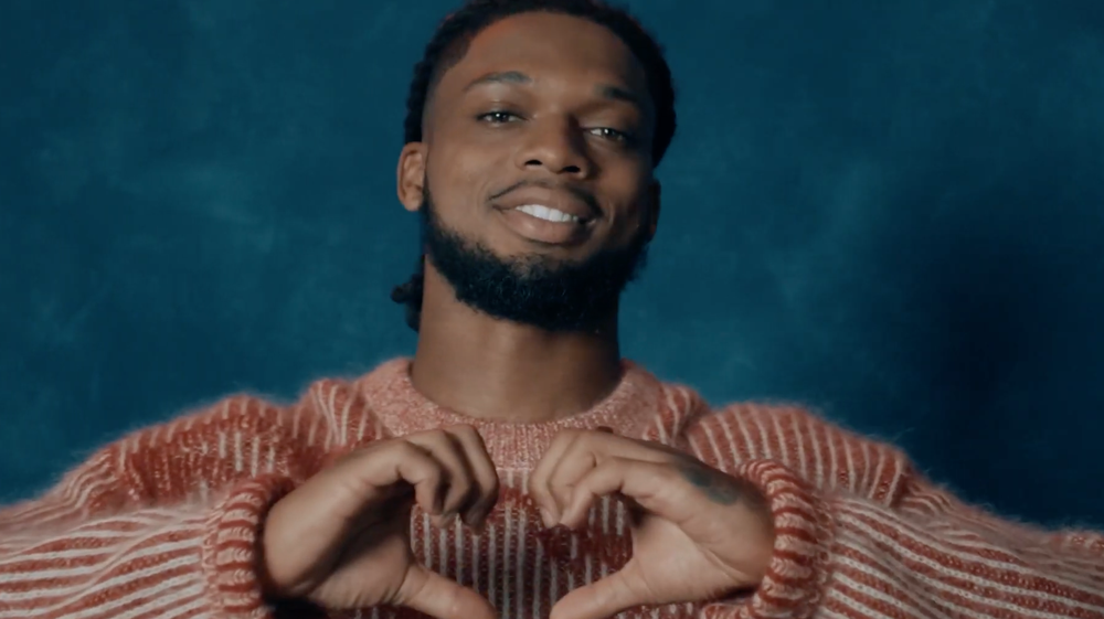 Damar Hamlin making a heart with his hands