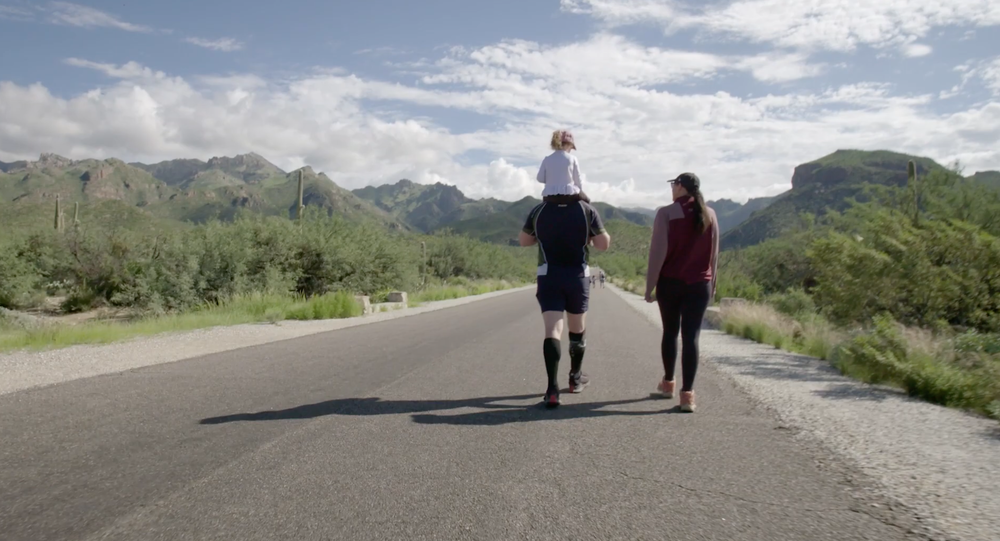 Robert and his family walking a mountain road, from Robert’s Story for Abbott