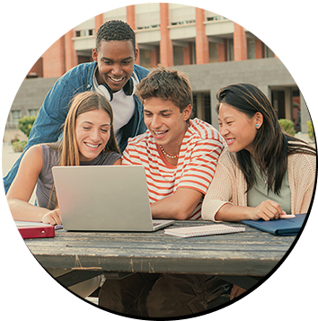 Students around a laptop computer