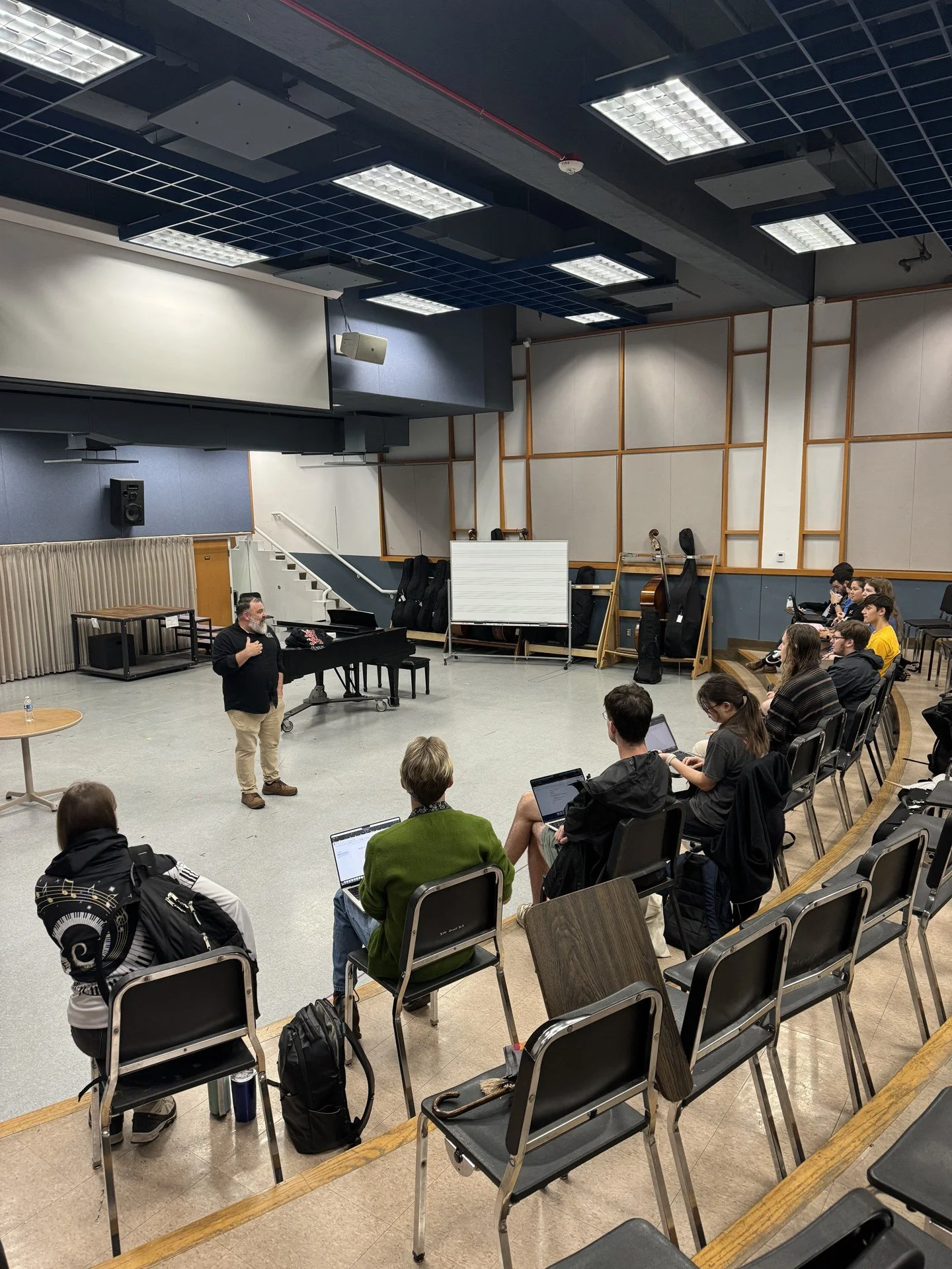 Mike speaking to participants seated in a University of Missouri–Kansas City music classroom.
