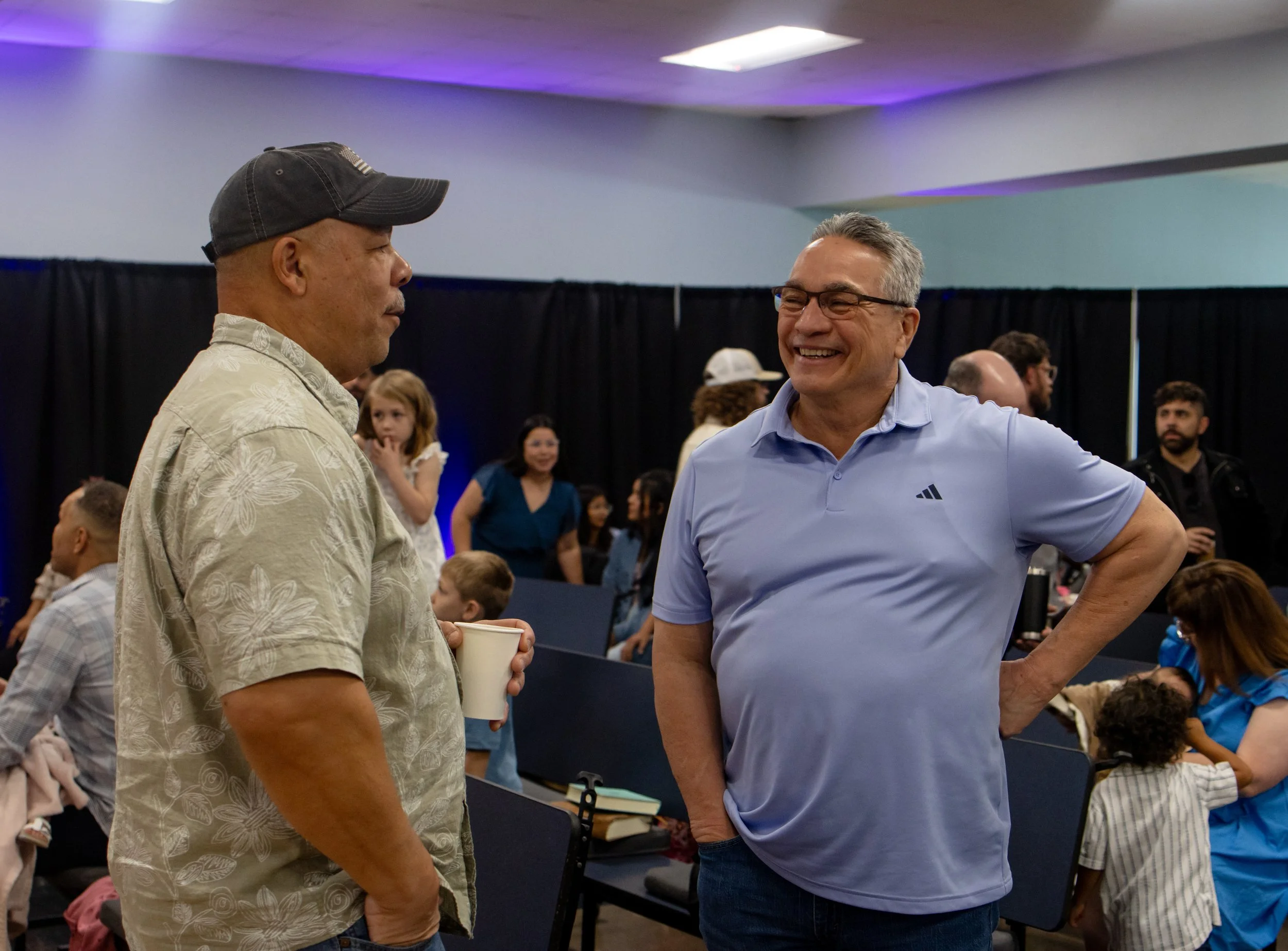 Worshipper with hand raised at Fervent Church
