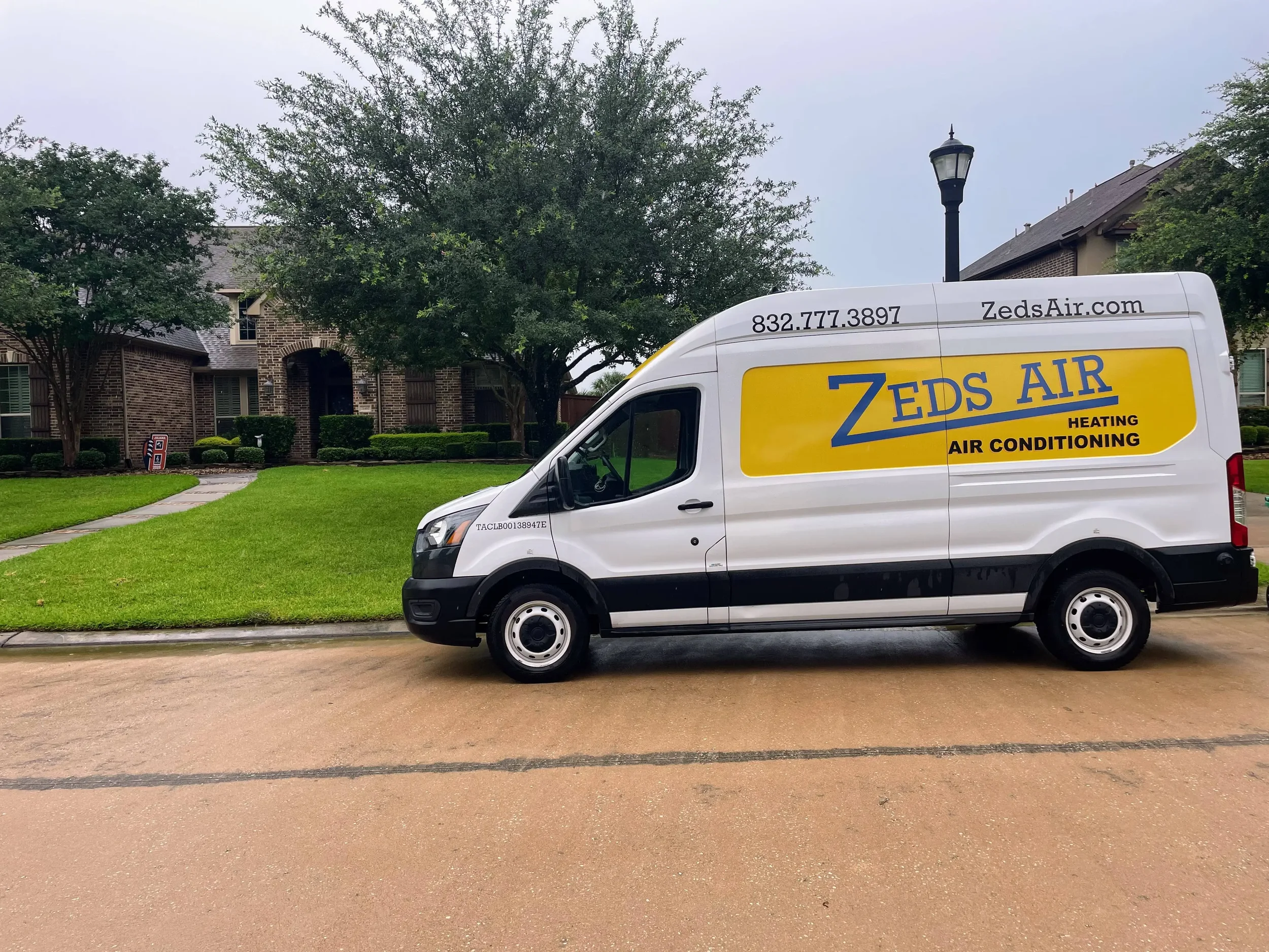 Zeds Air LLC service van parked in Cypress TX neighborhood — licensed HVAC contractor