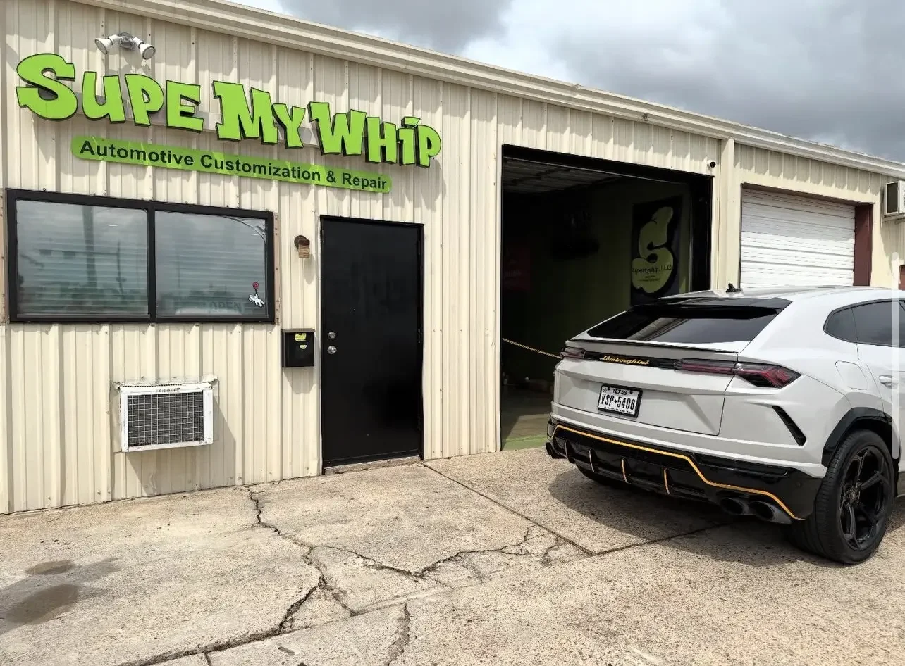 White Lamborghini Urus outside Supe My Whip