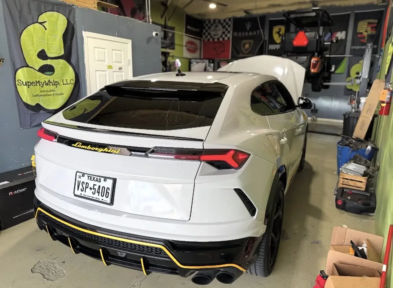 White Lamborghini Urus inside the Supe My Whip studio in Stafford, Texas