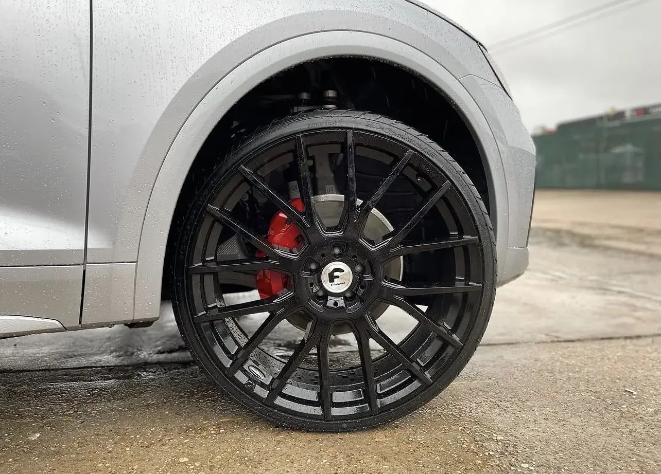 Black wheel with red brake caliper detail