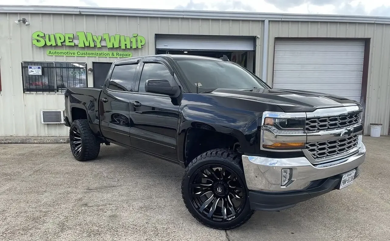 Black Chevrolet Silverado with custom wheels