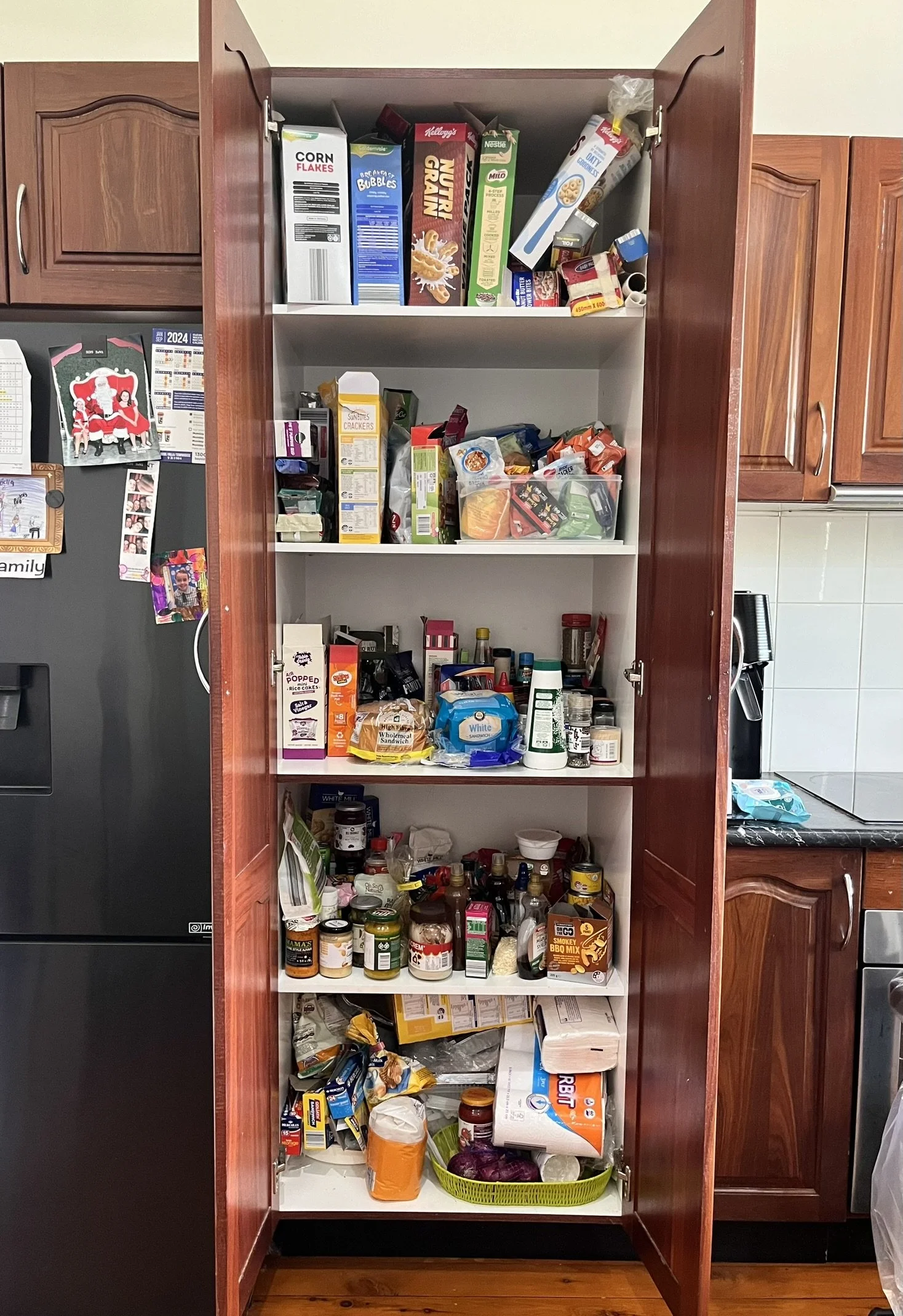 Disorganised kitchen pantry before