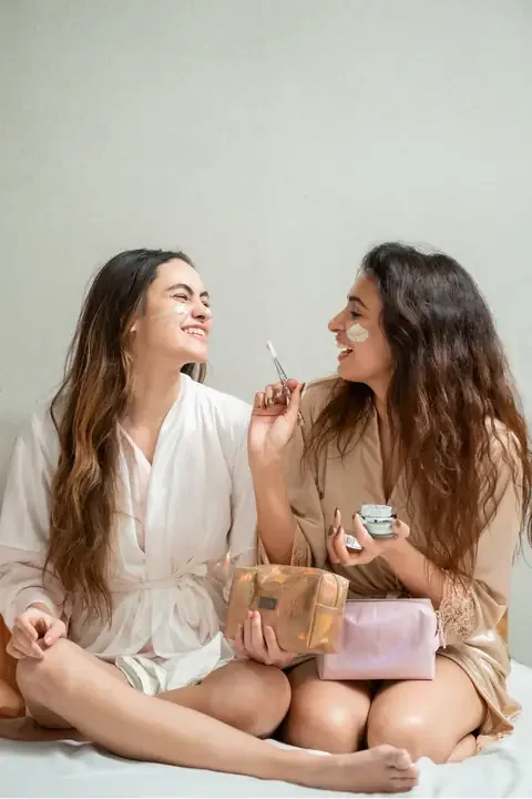 Two friends laughing with their LIMN skincare