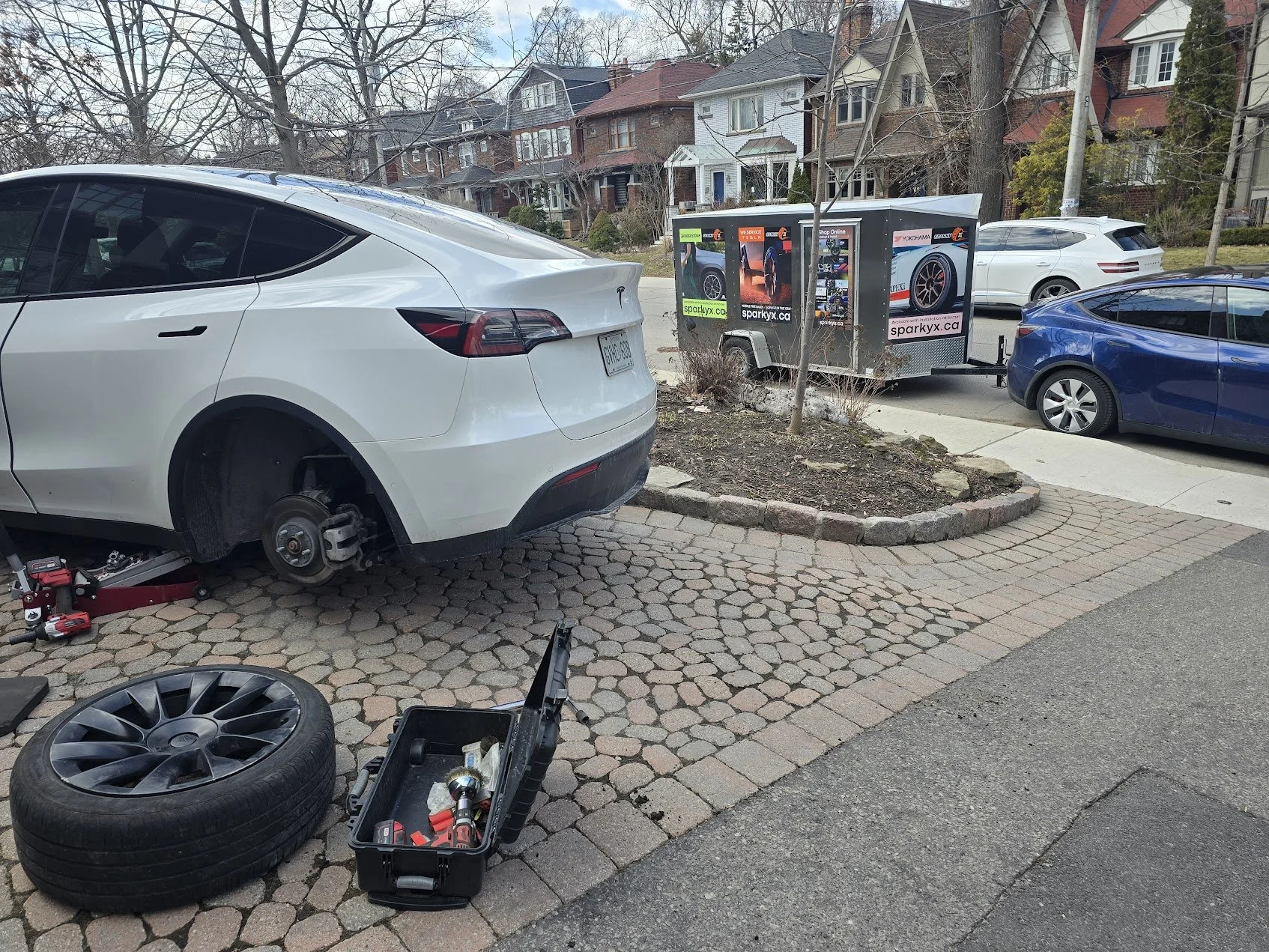 Performing Tesla mobile tire repair service in Toronto.