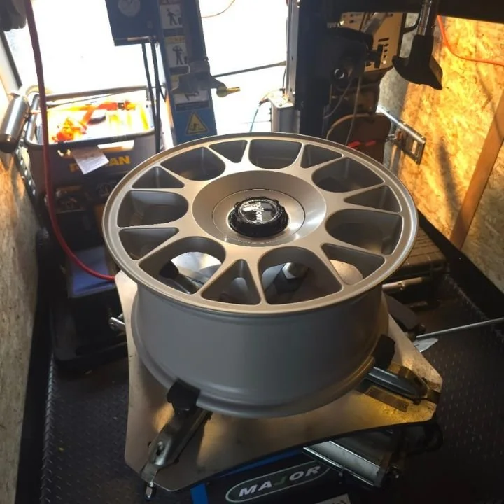 Sparky X technician performing professional mobile off-rim tire mounting and balancing in the GTA