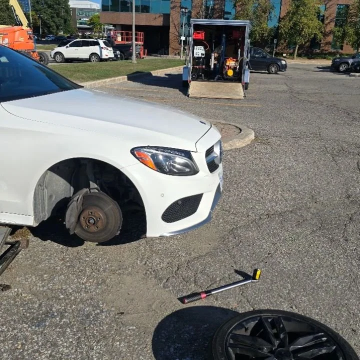 Sparky X technician performing professional internal plug-patch tire repair on-site