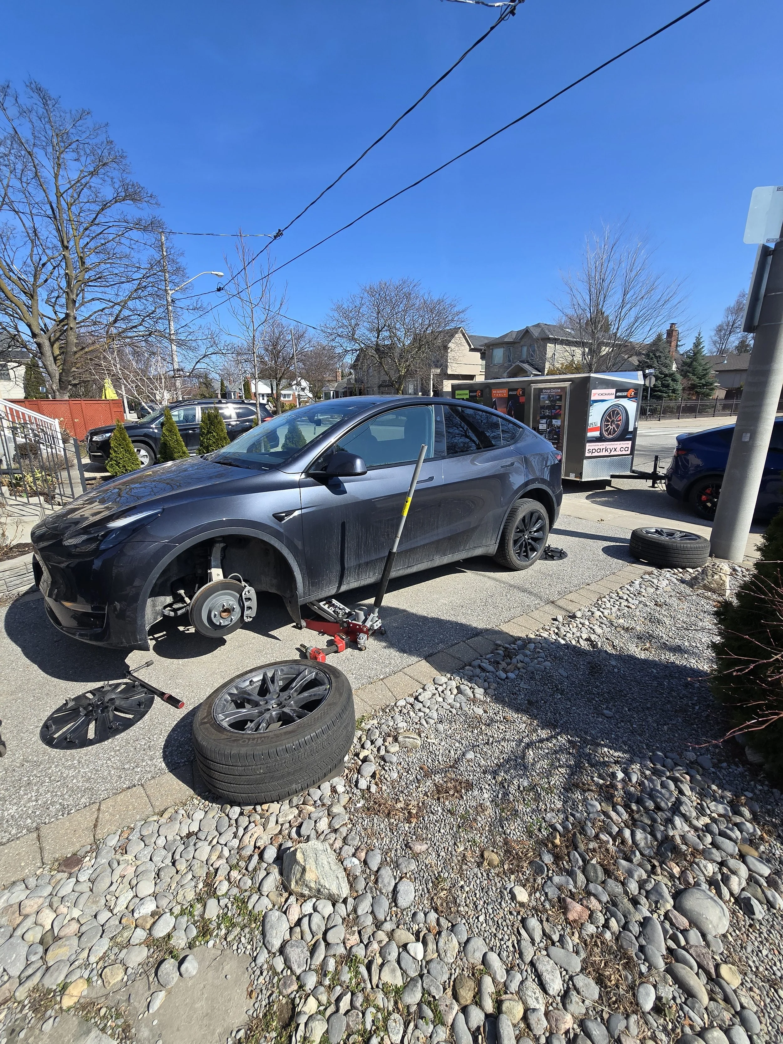 Specialized mobile tire service for Tesla, utilizing battery-safe lift points and professional grade equipment.