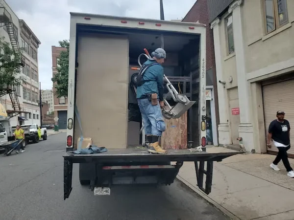 Furniture movers loading furniture in Brooklyn