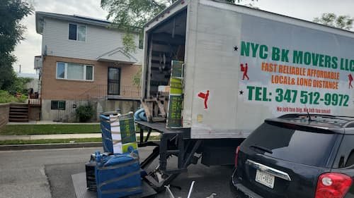 NYC Brooklyn Movers LLC moving truck parked on a Brooklyn street