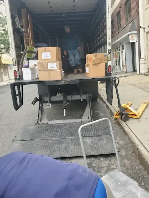 NYC Brooklyn Movers LLC loading truck with liftgate for apartment moving service