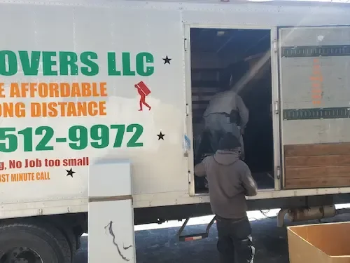 Professional movers loading a local moving truck
