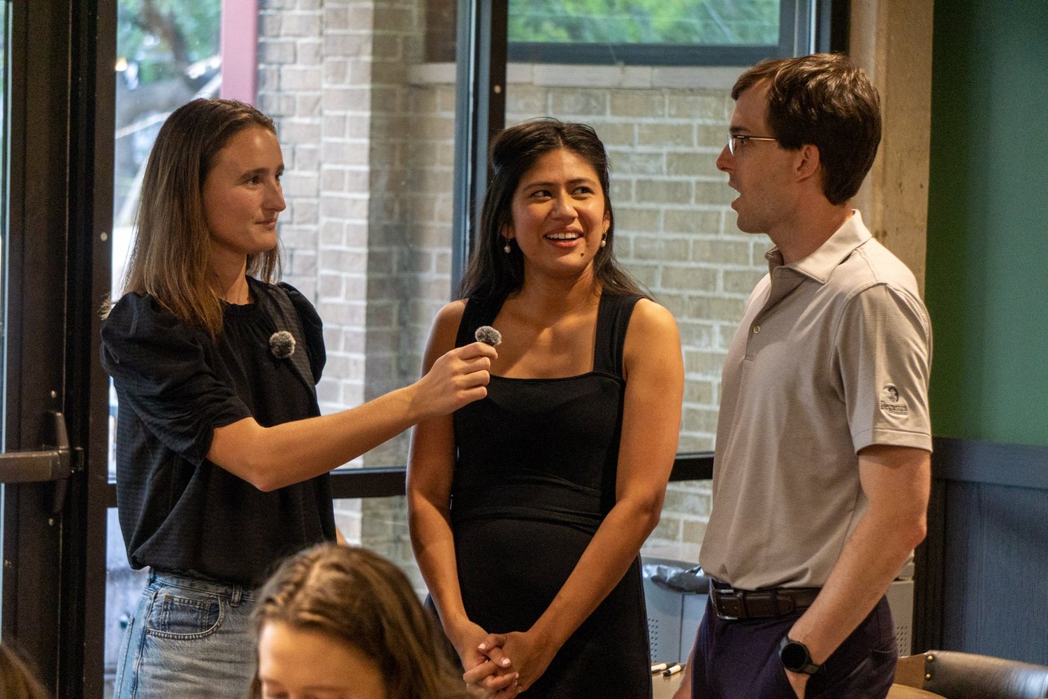 Three people talking at the workshop