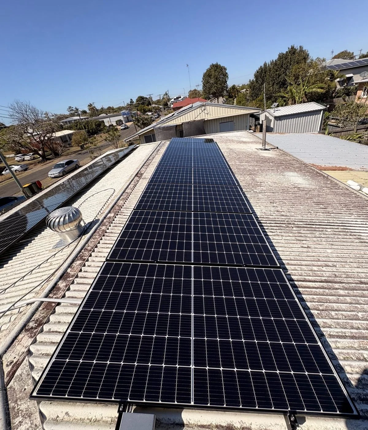 Clean solar panels on a Bundaberg roof