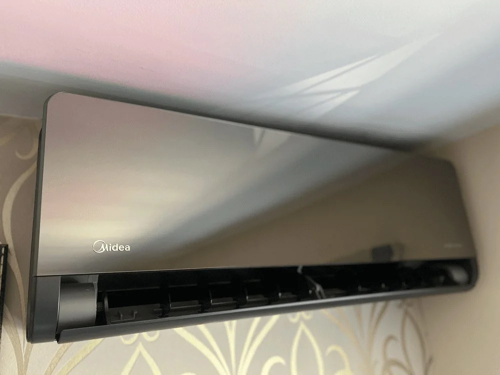 Silver wall-mounted indoor air conditioning unit