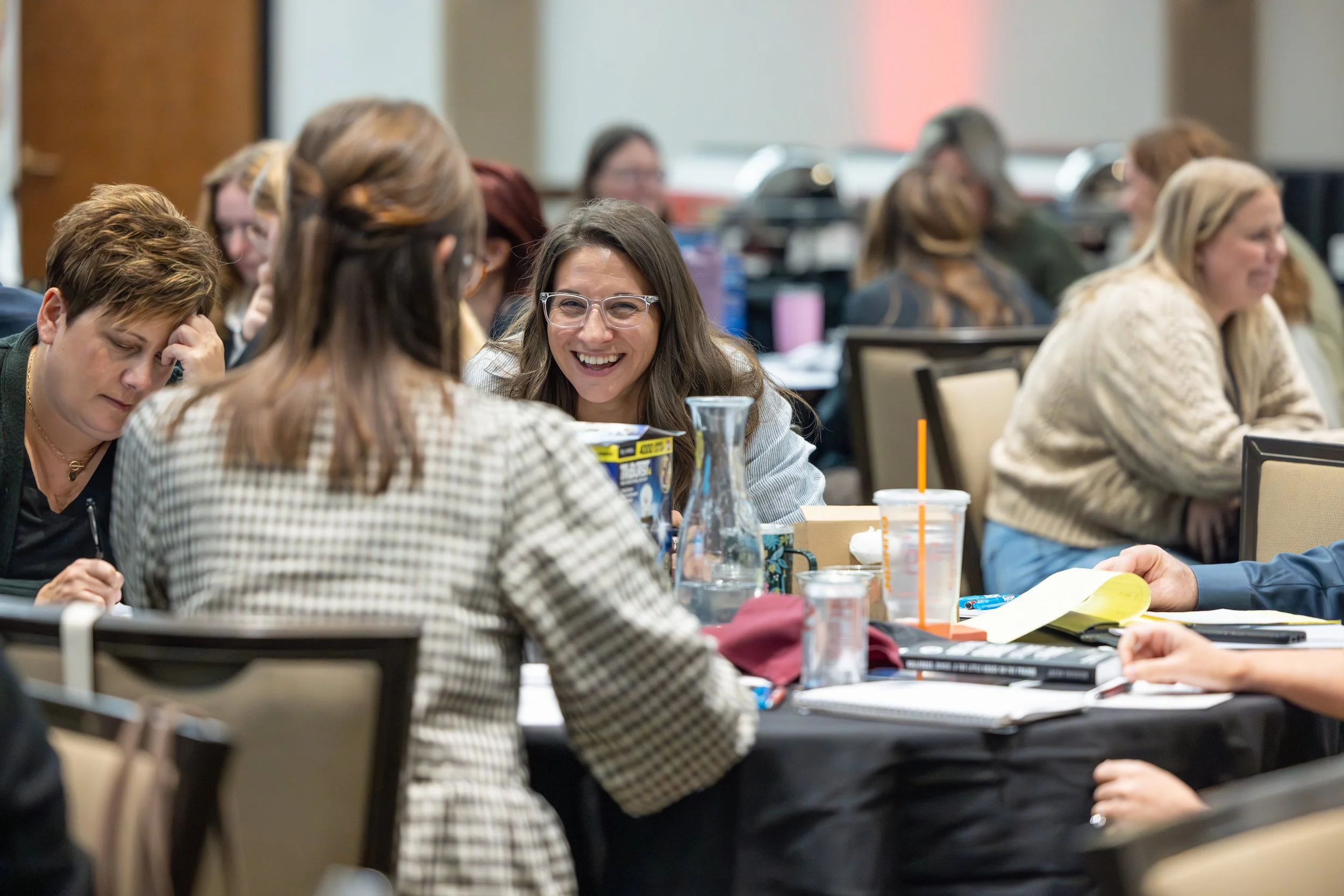 Attendees talking at tables