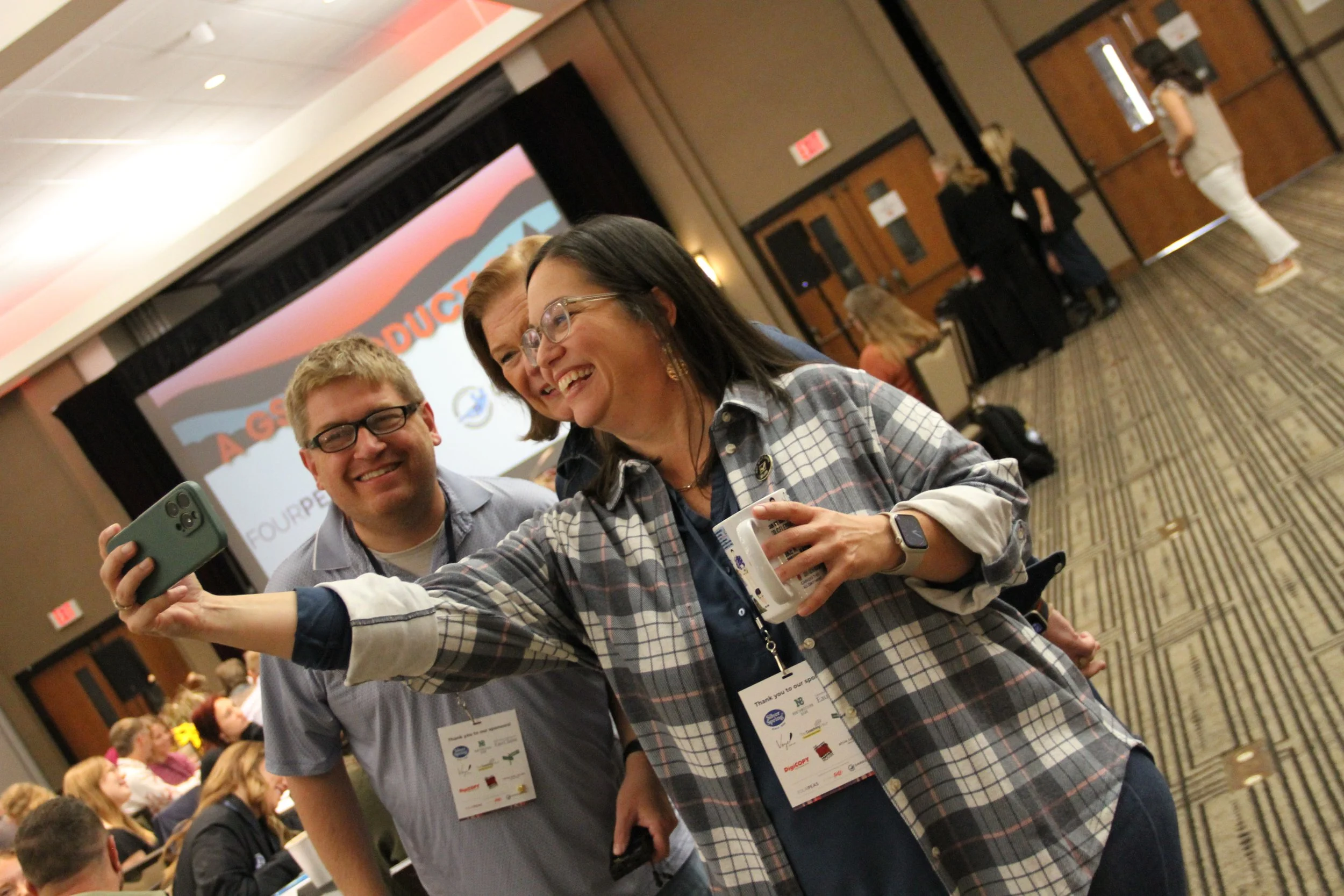 Two attendees laughing
