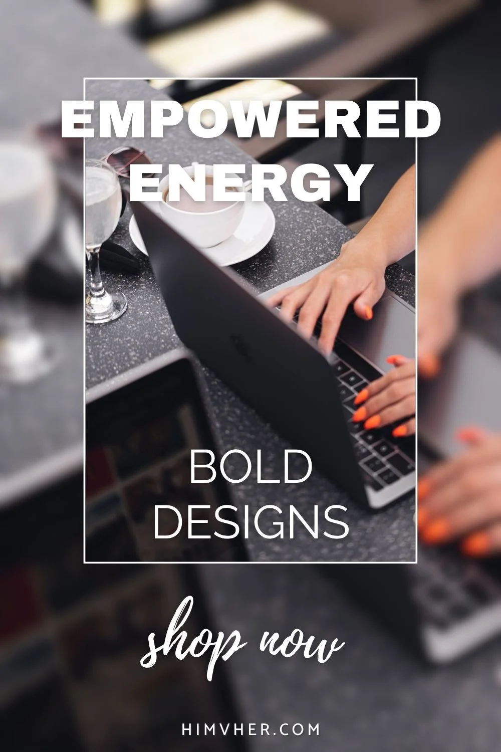 Close-up of woman typing on laptop with bright orange nails at café table — promoting bold, empowered energy design collection
