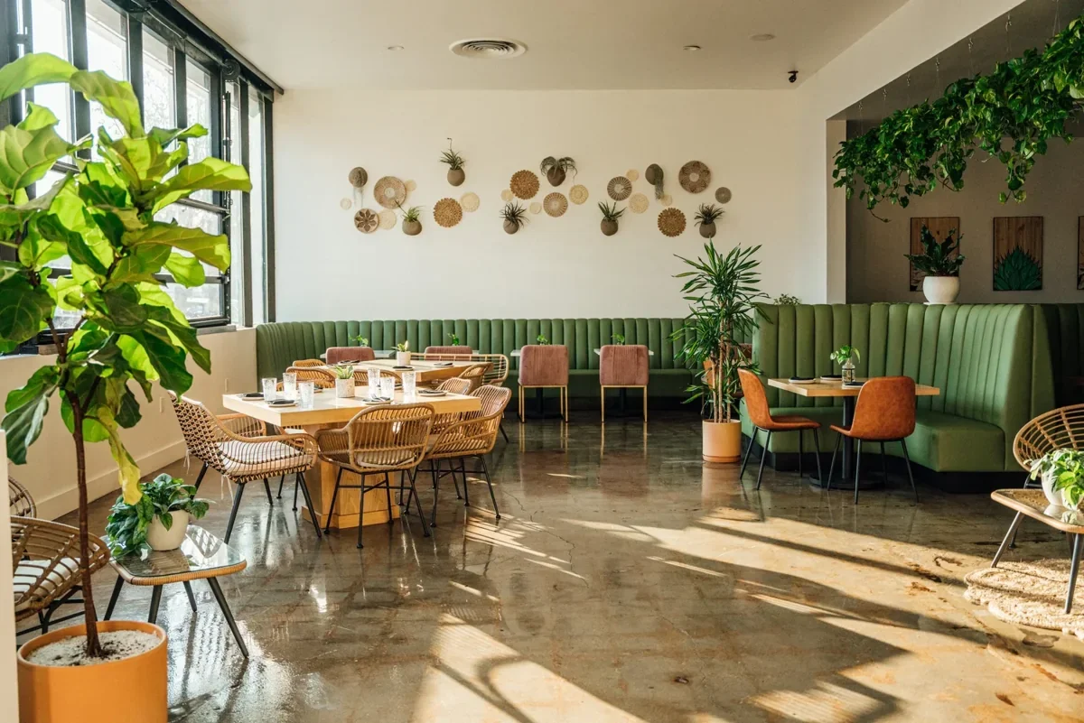 El Barrio Cantina dining room with green banquettes
