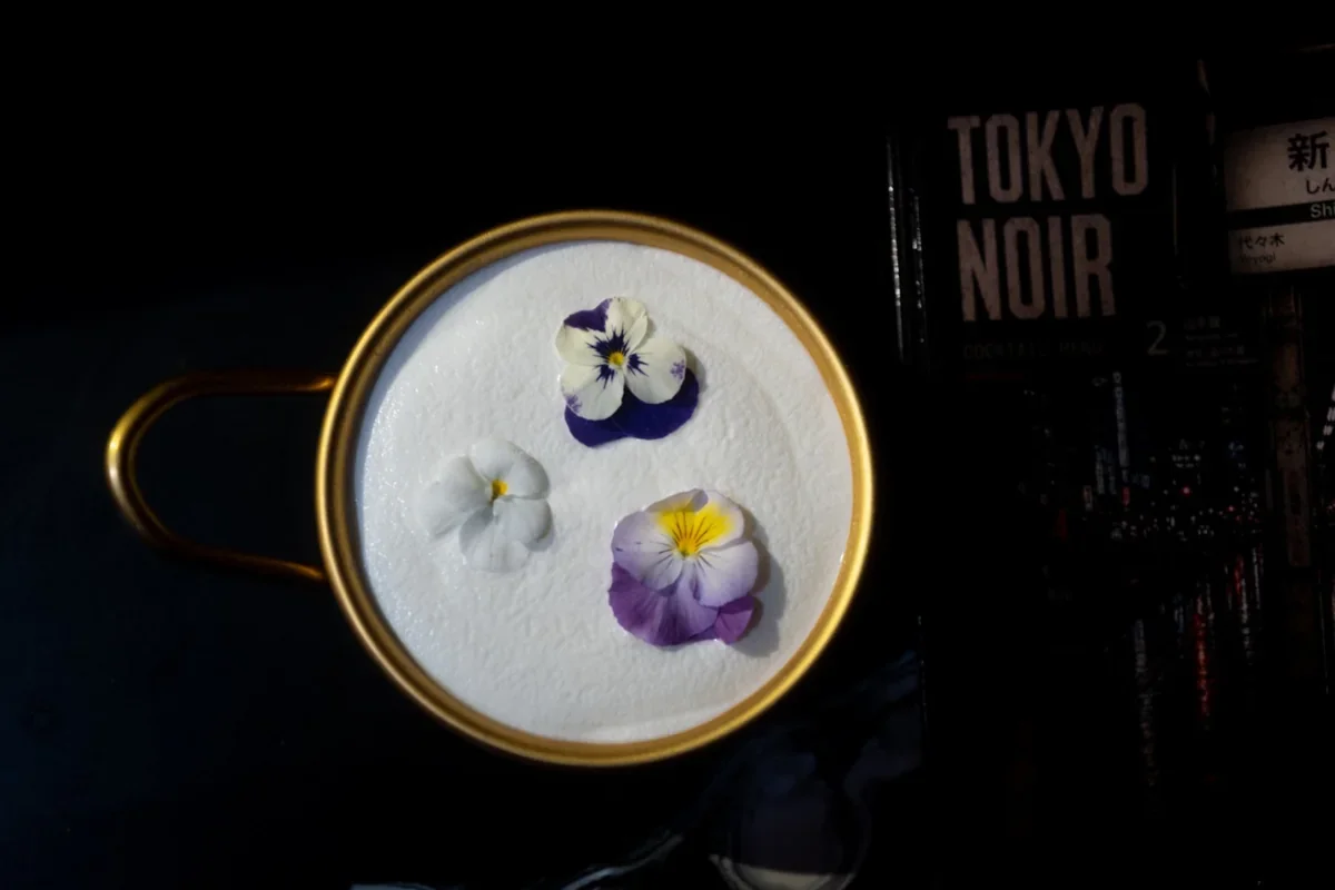 Tokyo Noir cocktail served in a floral cup