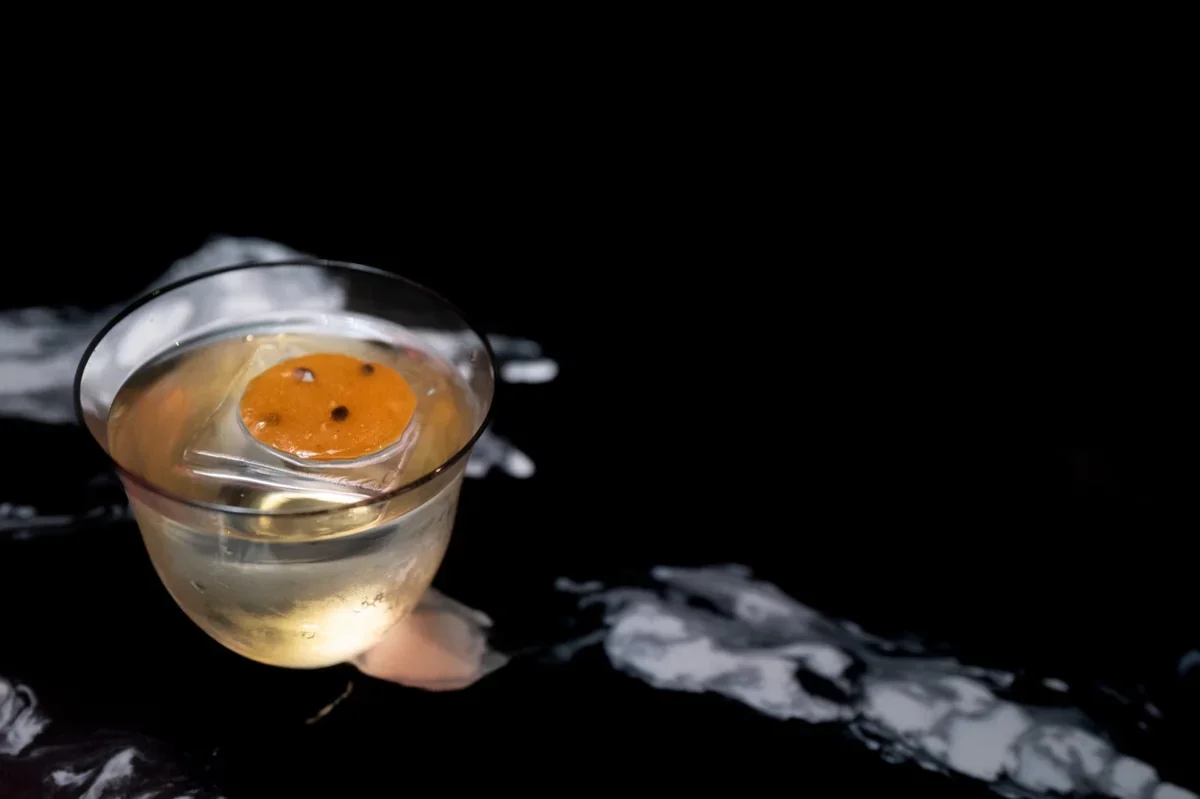 Tokyo Noir cocktail over a large piece of ice
