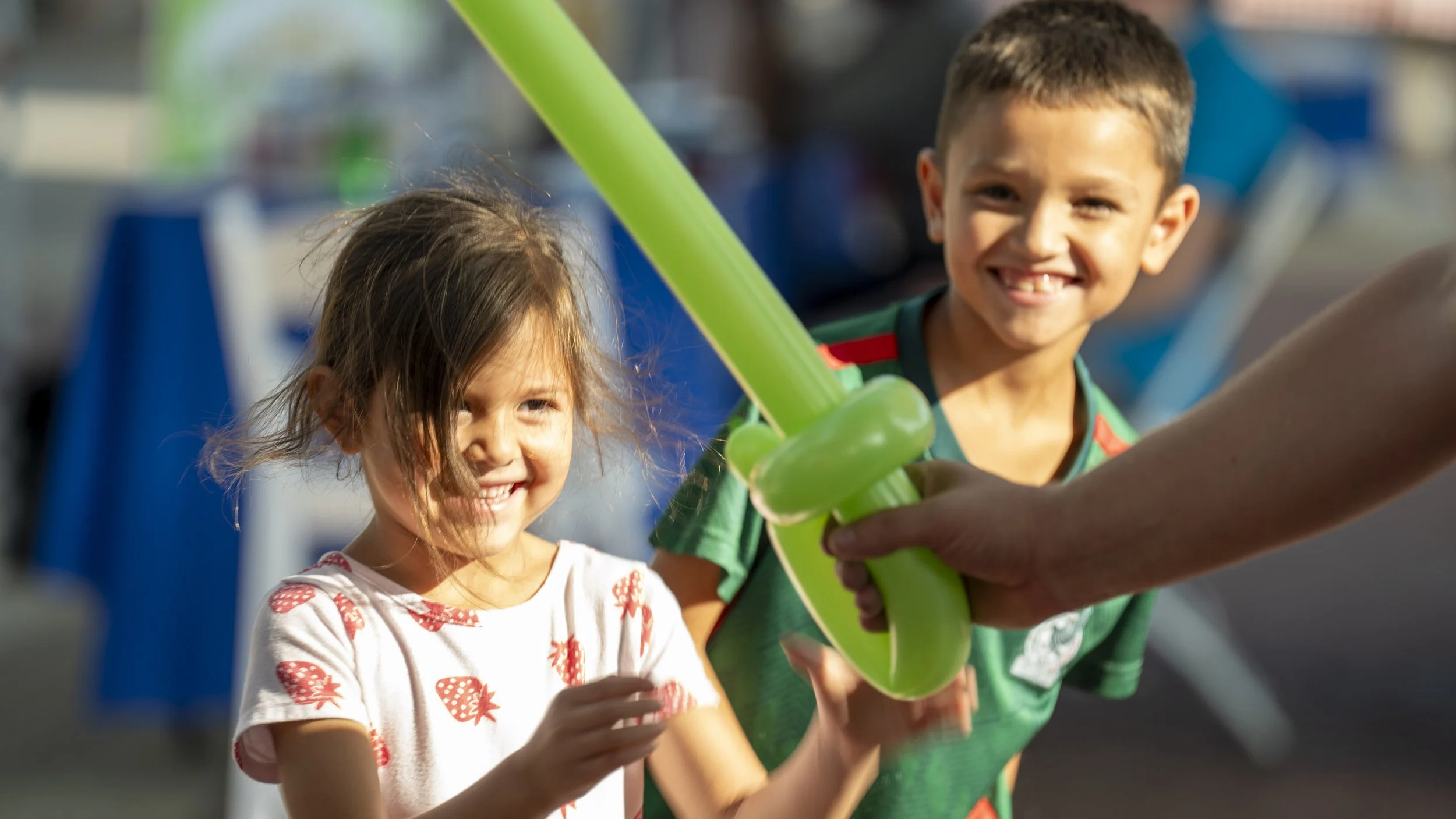 Kids enjoying balloon twisting