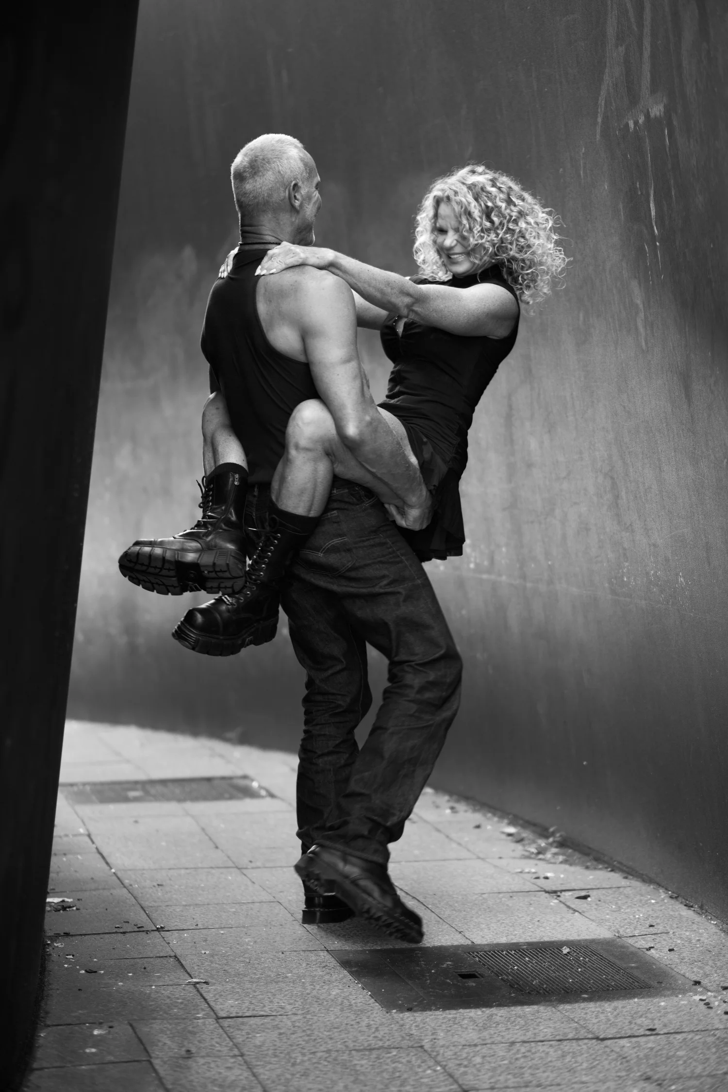 Mark lifting Chrisanna off the ground, both laughing