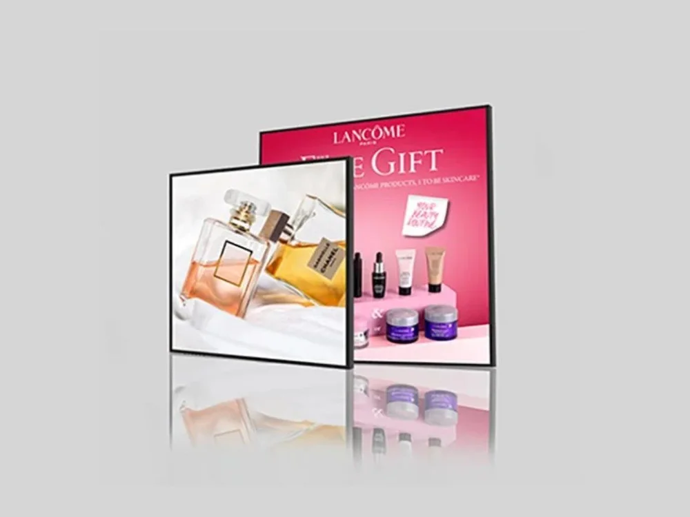 Square LCD retail display showing a cosmetics campaign on a slim wall-mounted screen