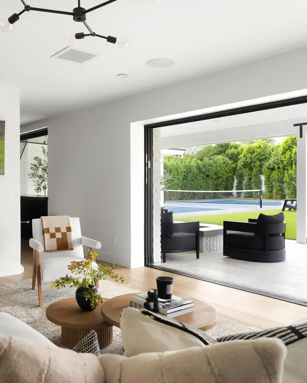 Scottsdale living room with seating arranged beside large patio doors