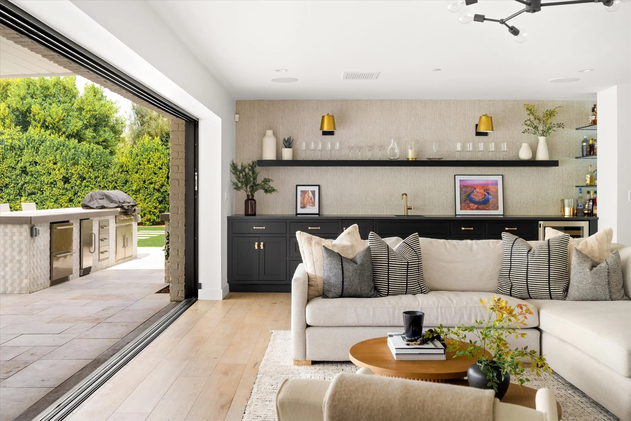 Cozy transitional family room in Scottsdale with a built-in wet bar, layered textures, and comfortable seating.