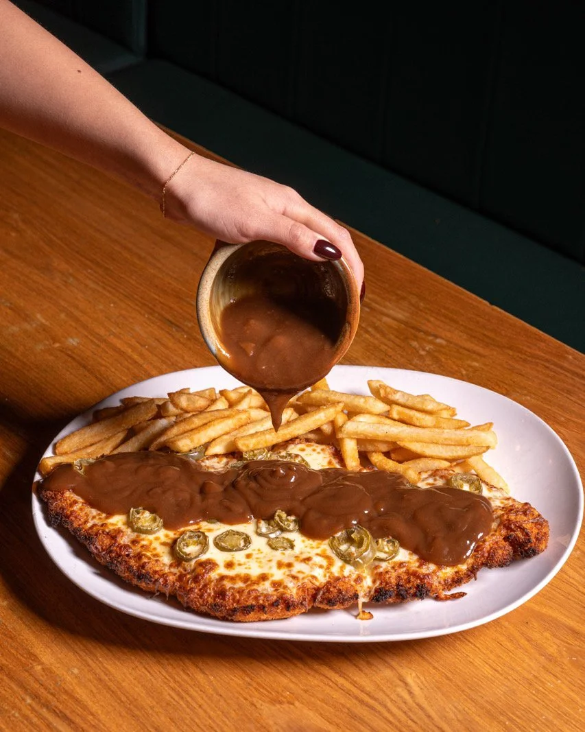 Gravy poured over a Da Vinci schnitzel