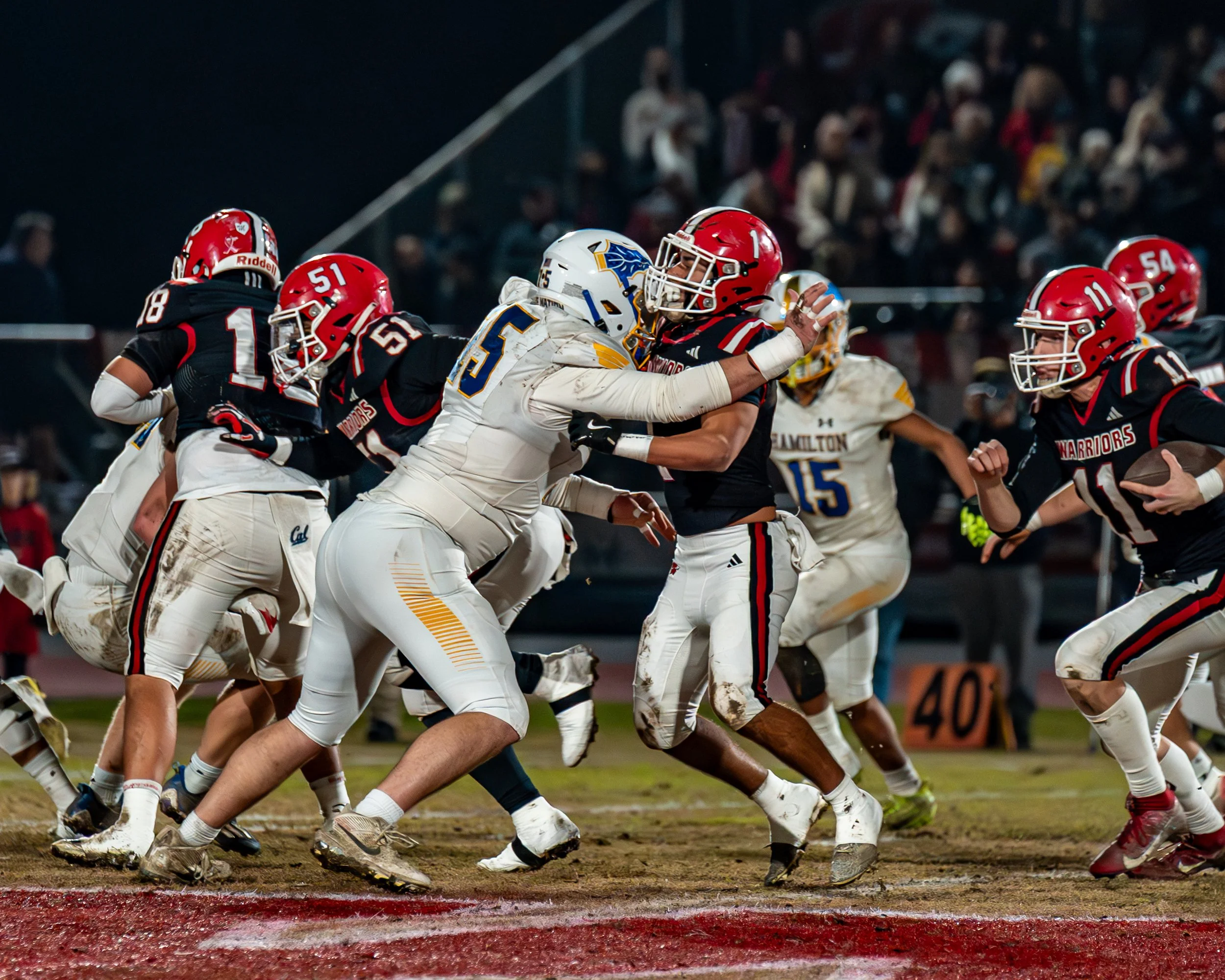 Hamilton senior Adam Simpson applies pressure against Winters