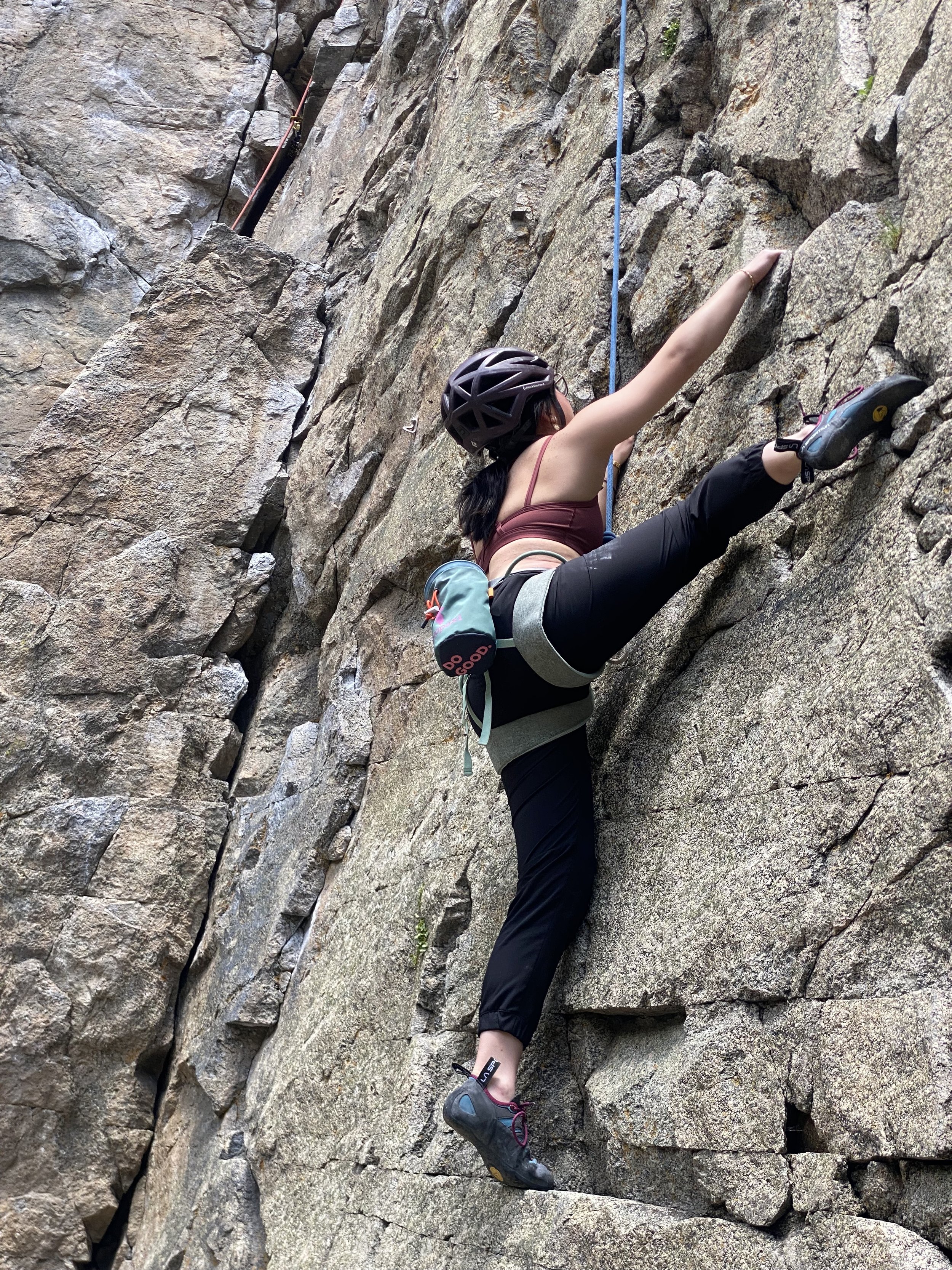 Climber using cracks and edges on Boulder Canyon granite