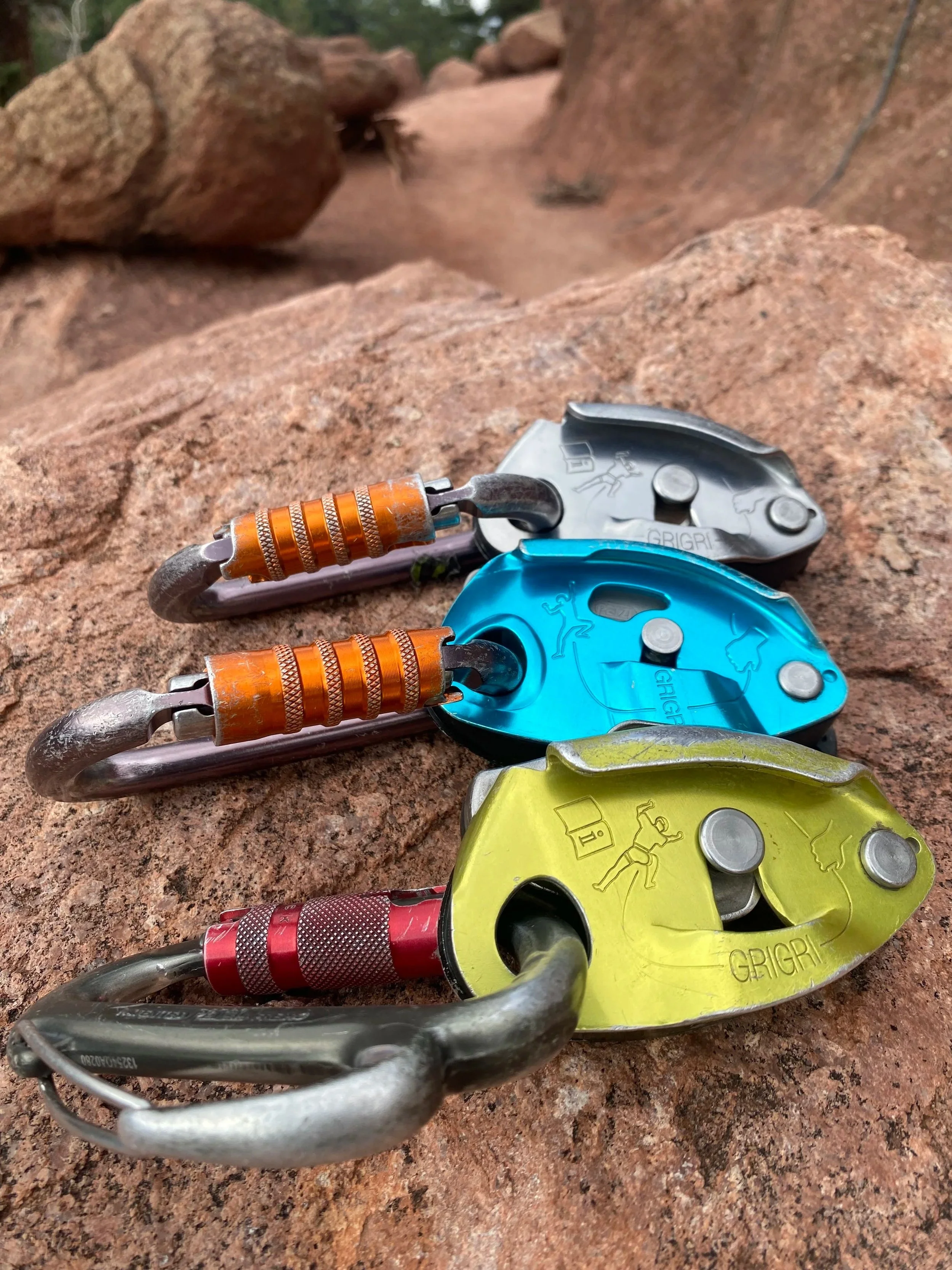 Assisted-braking belay devices and locking carabiners on sandstone
