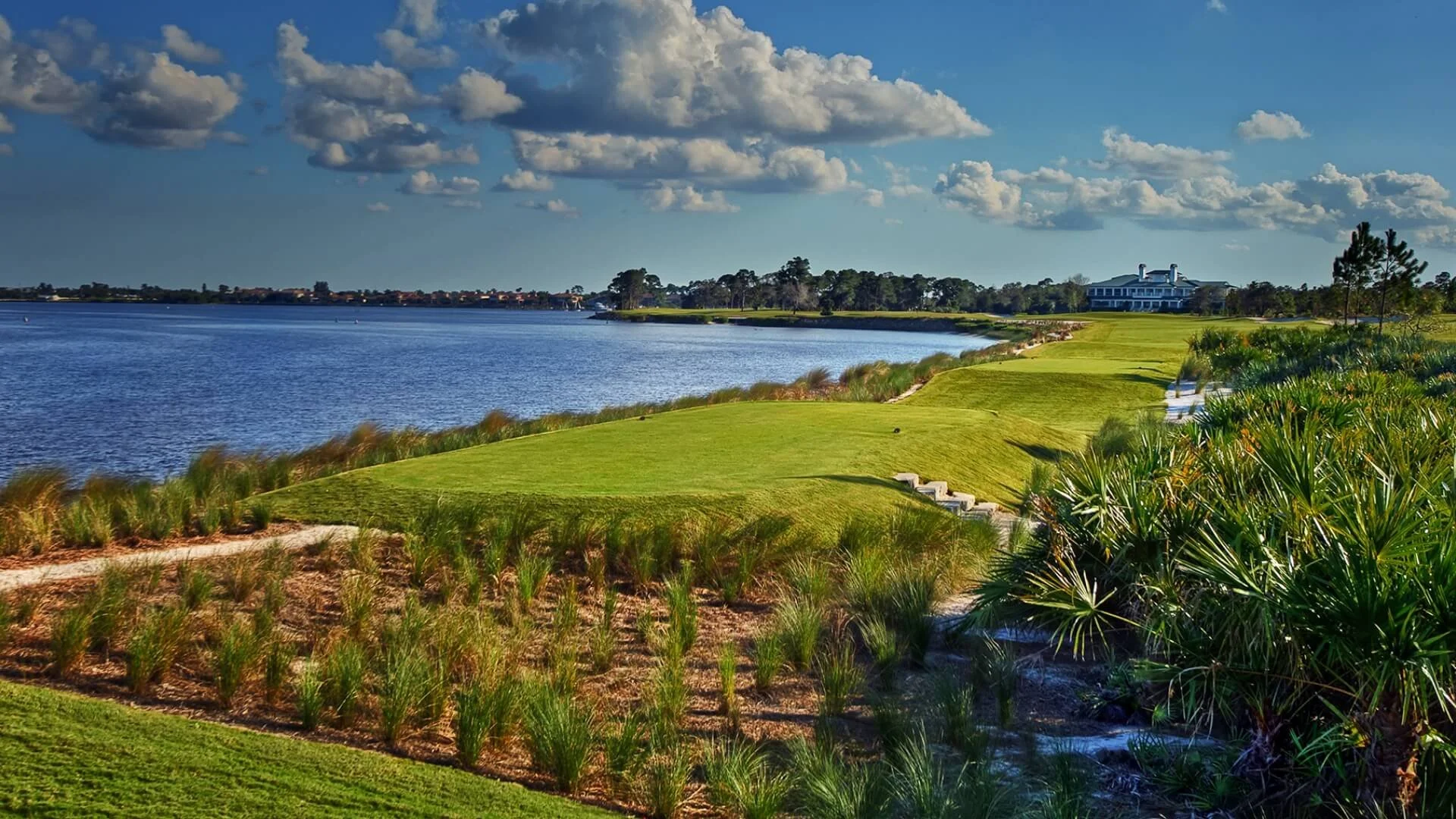 St. Lucie River waterway bordering Floridian National Golf Club, clubhouse in the distance