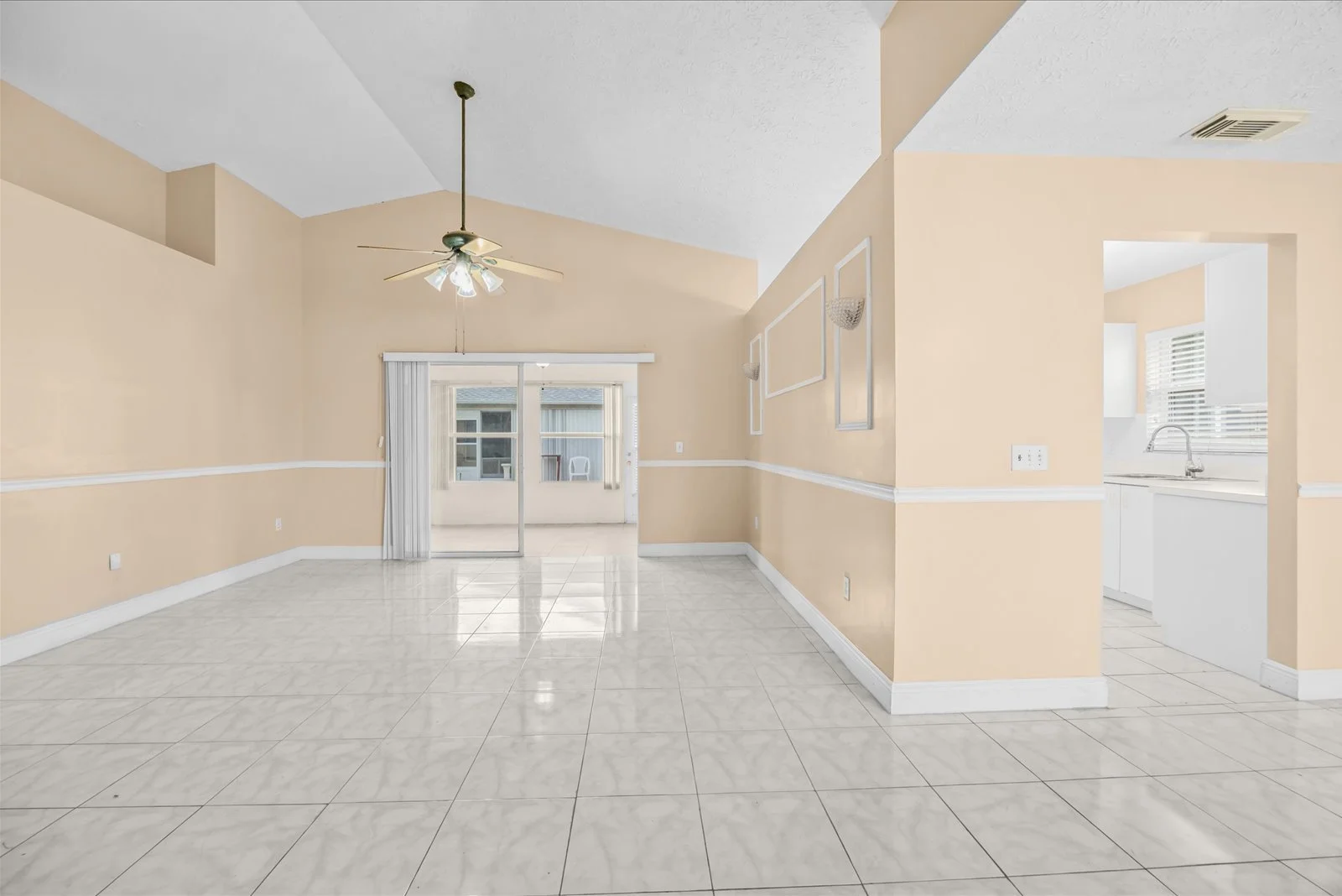 Vaulted-ceiling living room — 413 European Ln, Fort Pierce FL